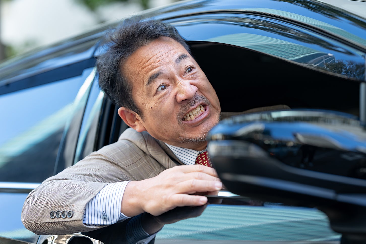 交通トラブルに巻き込まれ怒り狂う、佐藤翔也さん（仮名）。